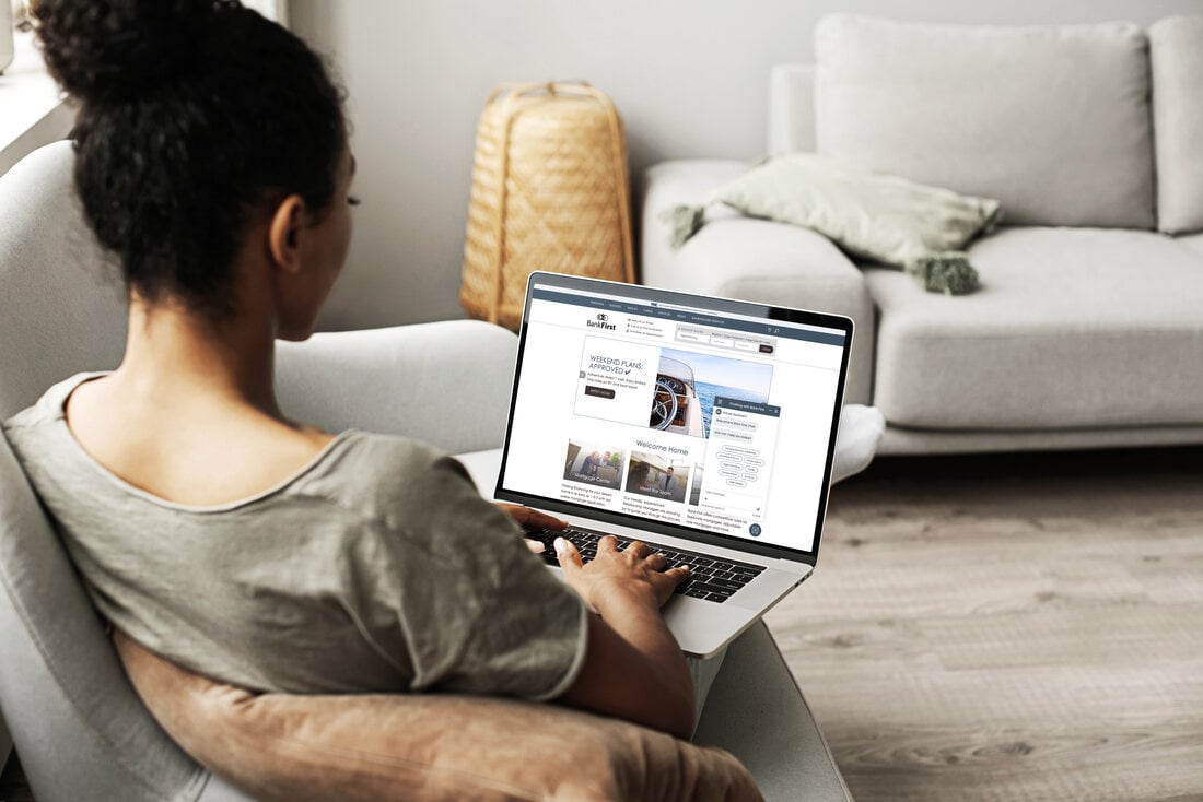 An account holder using Bank First digital banking with an Agent IQ chat conversation open